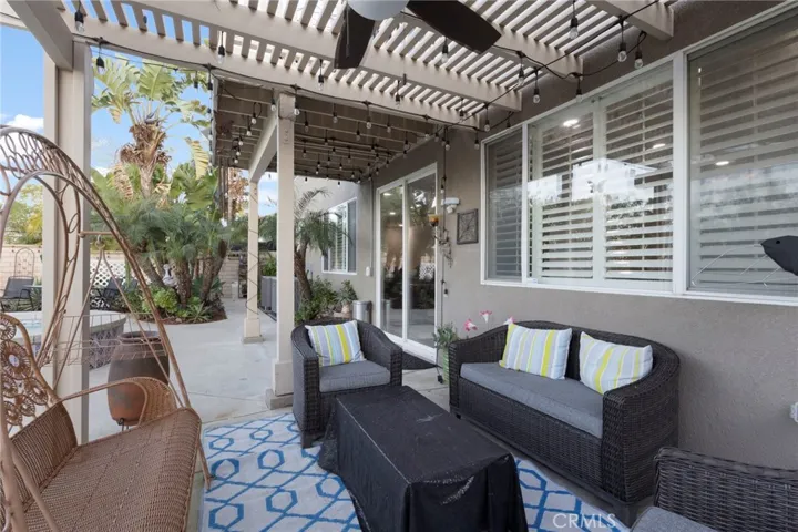 Seating area outside the back patio doors which lead out from the kitchen / dining room and over looks the pool view and city views.