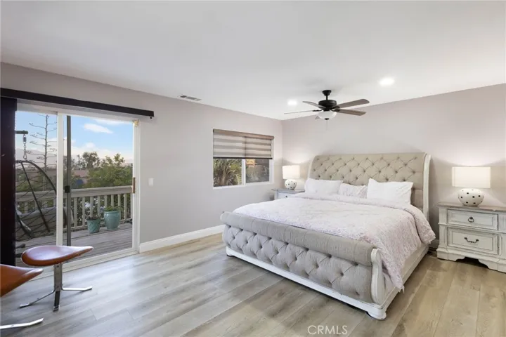 Amazing master bedroom with sweeping city views all the way to the mountains from private balcony.