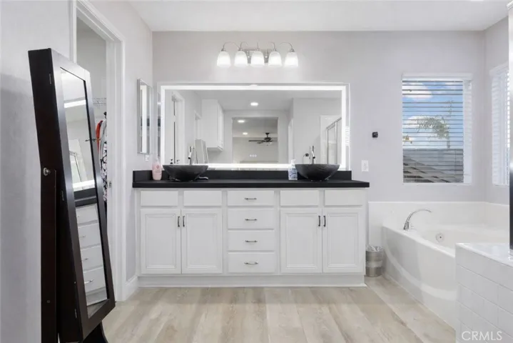 Master bathroom in master suite, with over sized his and hers walk in closets to the left.