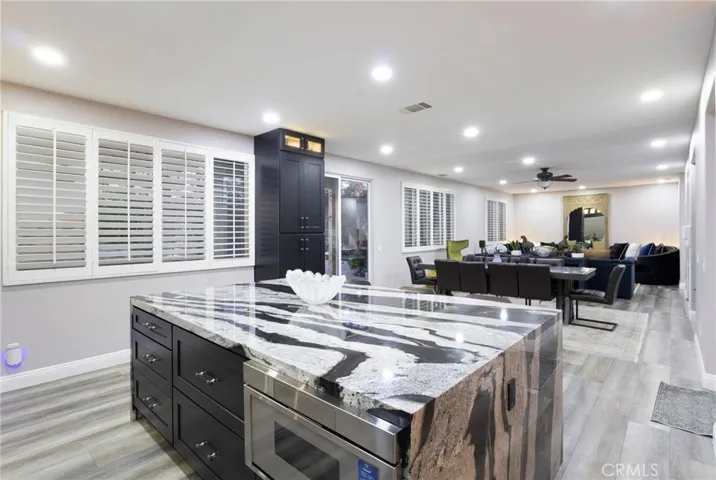 Commerical Thermador microwave fitted into the massive kitchen island with even more storage cabinetry.