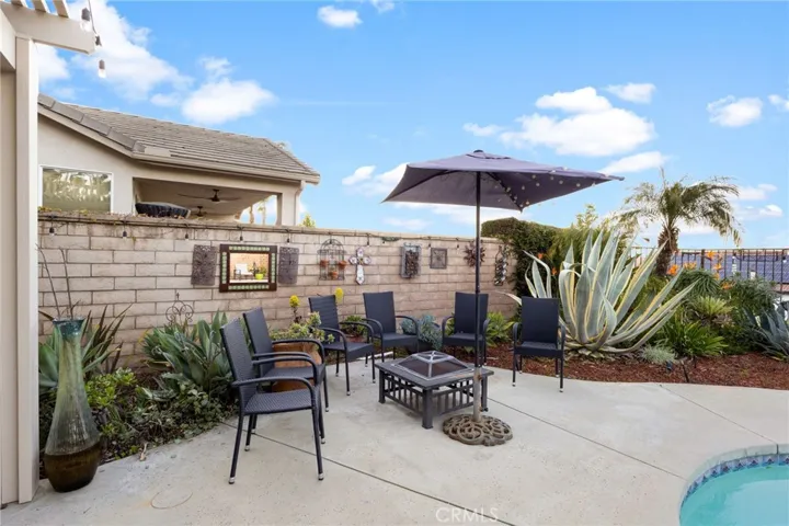 Second outside seating area with pool and city views.