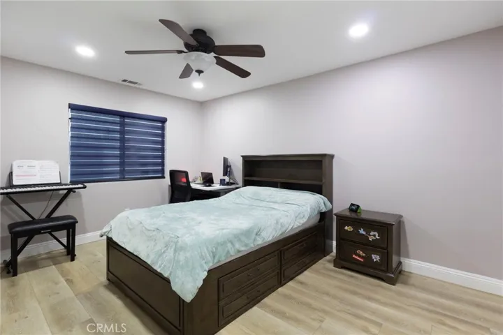 Third bedroom that shares the full jack and jill bathroom, with bathroom access to the left.