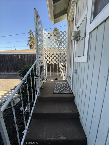 Backyard stairs into home.