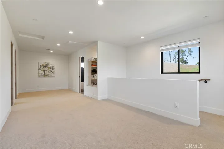 The open cabinet on the right by bathroom has since received it's cabinet doors for closure.