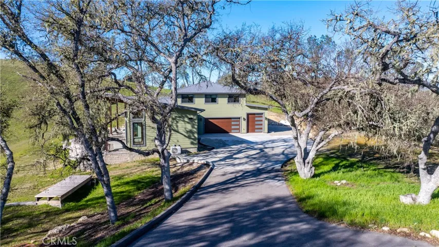 Just wait till you see this home when the trees fill in. Well actually you won't see the home but you will see the driveway that goes under the trees to the house