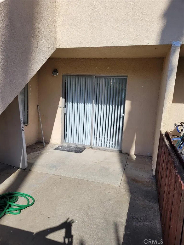 Bedroom two has sliding glass door the private yard,