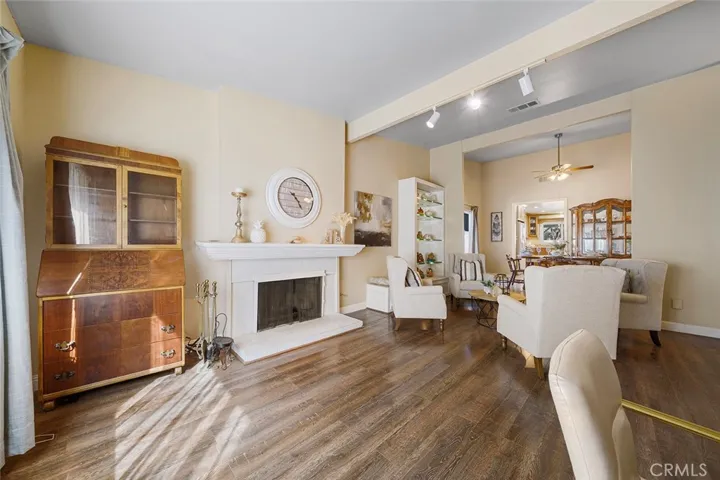 Spacious living room with fireplace and one step up to the dining area.