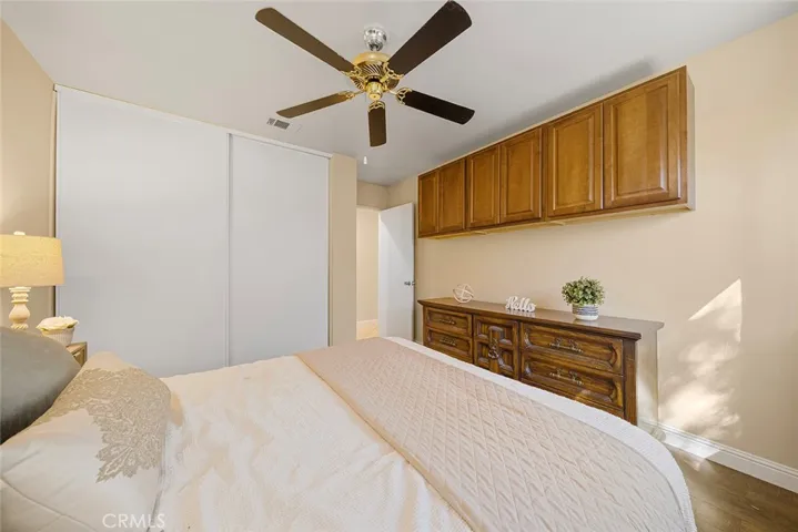 Three of four bedrooms with built ins and ceiling fan.