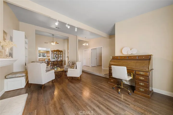 Spacious formal living room. One can put a family desk as shown in the image or a perfect place for a piano or a sectional; However you wish to use...