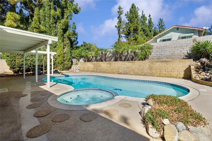 Beautiful pool and hot tub to jump in or relax. L-shaped  covered patio for you to enjoy all year long.