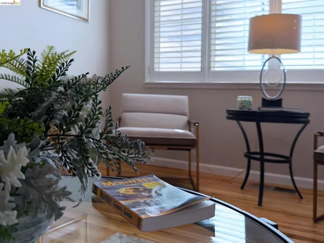Sitting room with light wood-style flooring and baseboards