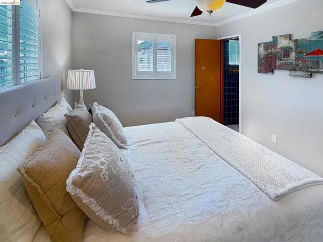 Bedroom featuring crown molding and ceiling fan