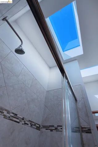 Bathroom view of a tile shower