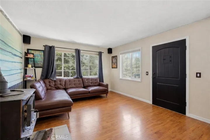 family room and entry. visual or ai adjustments may have been used