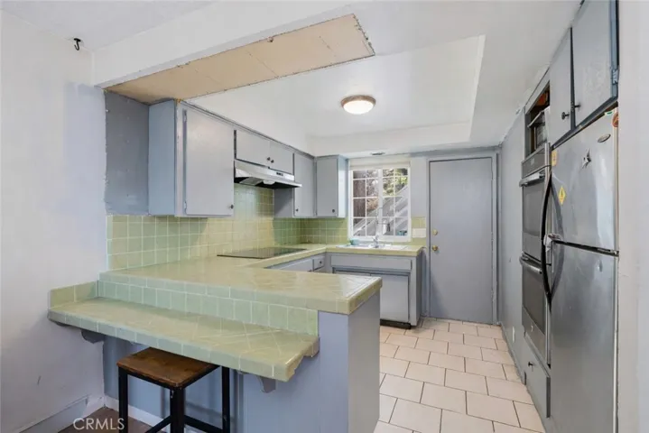 Kitchen, cabinet removed from above island. visual or ai adjustments may have been used