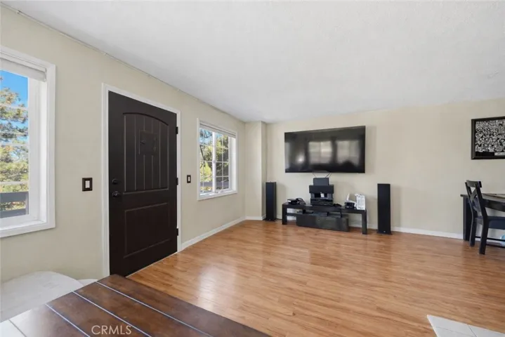family room and entry, visual or ai adjustments may have been used