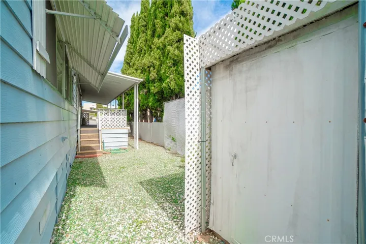 East side of home with shed