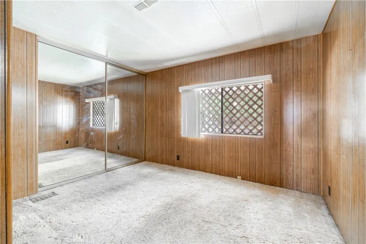Bedroom One with Mirrored Closets