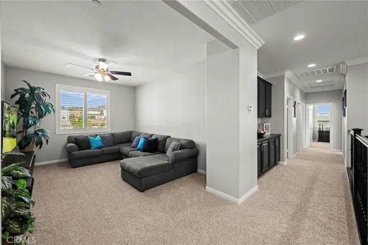 Versatile upstairs loft retreat:
Located at the top of the staircase, this spacious loft offers the perfect setting for relaxation or recreation. Whether envisioned as a media lounge, home office, or reading nook, this inviting space adds comfort, flexibility, and style to the upper level.