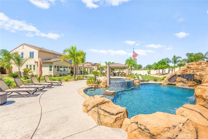 Breathtaking backyard oasis:
Take it all in—the shimmering PebbleTec® pool and spa, the resort-inspired outdoor kitchen, the meticulously curated landscaping, and the stunning view of the home itself. Every inch of the grounds has been masterfully designed to create a perfect balance of luxury, leisure, and timeless beauty.