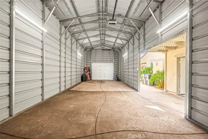 Interior of the RV garage:
The interior of the RV garage continues the home’s refined design aesthetic, featuring the same custom-stamped concrete flooring for a seamless, polished look. Every detail reflects quality craftsmanship and cohesive style, extending the home’s elegance into this functional space.