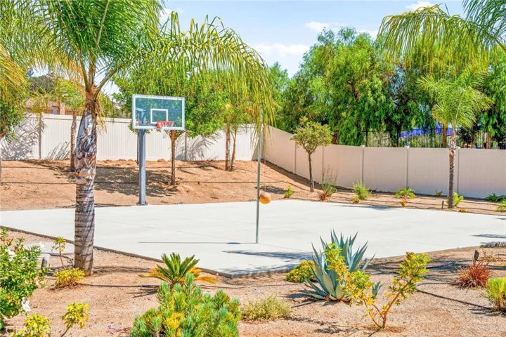 Private sports court and recreation area:
The property includes a custom half-court basketball setup and tetherball area—perfect for outdoor fun and friendly competition. Designed with versatility in mind, the court can easily be painted and transformed into a pickleball court, offering endless options for recreation and entertainment.