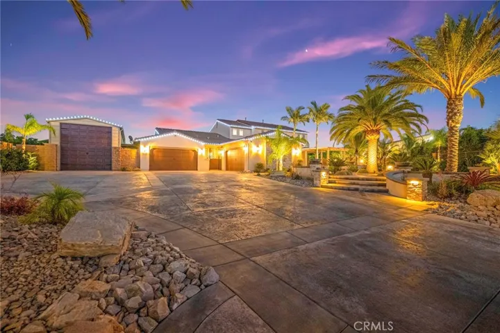 Expansive custom driveway:
A grand, custom-stamped concrete driveway offers a striking first impression, combining elegant design with exceptional craftsmanship. Its expansive layout provides ample parking and complements the home’s impressive curb appeal.