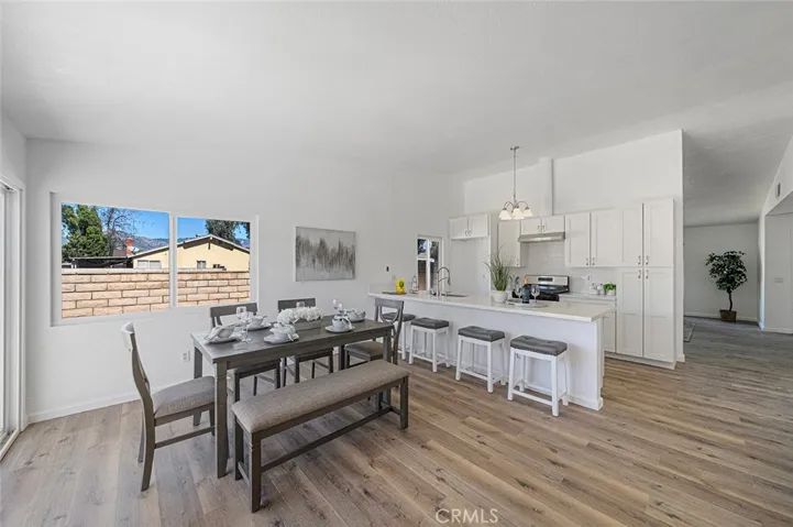 Fabulous updated kitchen with quartz counters and room to dine at the peninsula. Luxury vinyl plank flooring throughout. Newer double pane windows and slider. Corner fireplace adds warmth and charm. Soft close cabinets and drawers. New light fixture, sink, dishwasher and stove and hood.