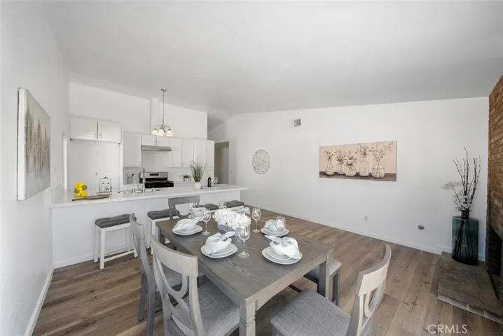 Fabulous updated kitchen with quartz counters and room to dine at the peninsula. Luxury vinyl plank flooring throughout. Newer double pane windows and slider. Corner fireplace adds warmth and charm. Soft close cabinets and drawers. New light fixture, sink, dishwasher and stove and hood.