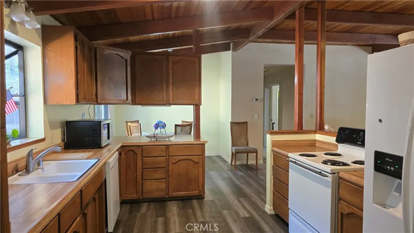 Gorgeous Wood Ceilings extend to kitchen