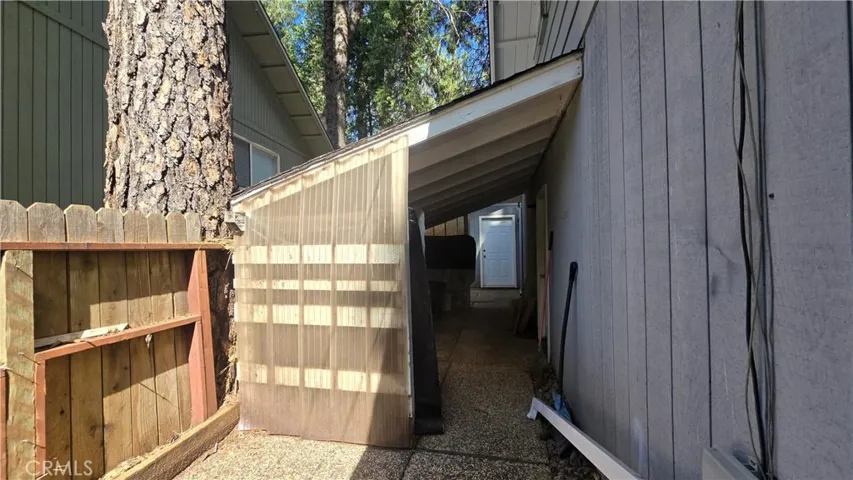 Covered Woodshed & Storage on side of Garage