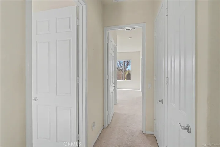 Hallway to office and primary bedroom