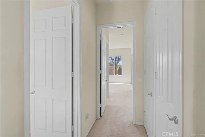 Hallway to office and primary bedroom