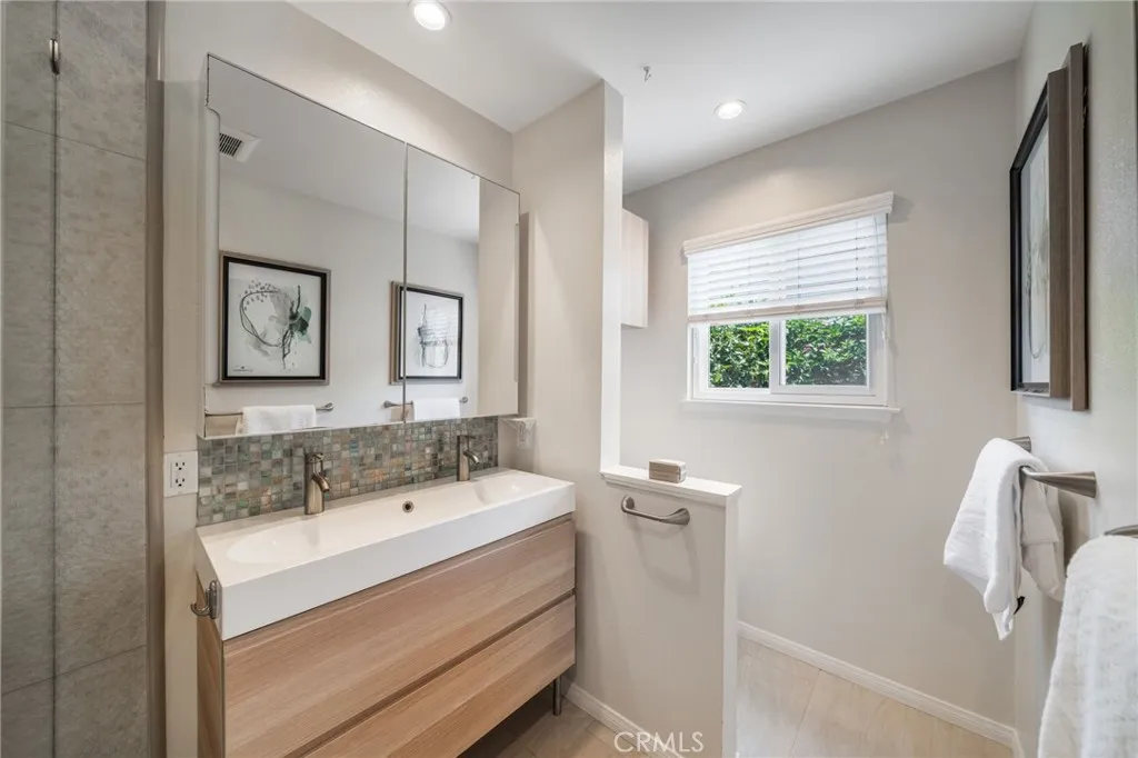 Primary bath has window that opens to outside.