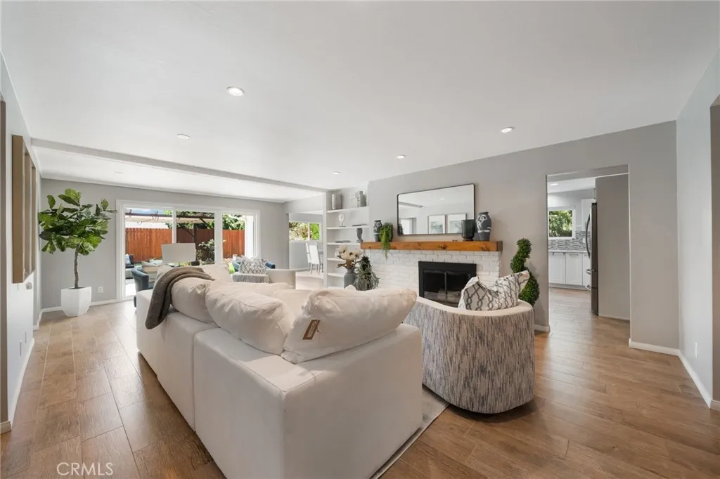 The home has a wonderful circular entertainment flow! The kitchen is to the right and open to dining area which circles back into the Main room. And also easy access to the back yard from front room or the family room.