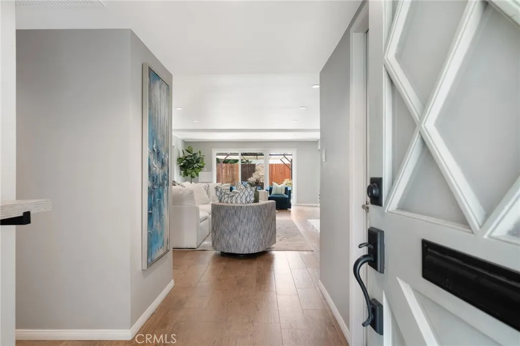Welcome to this beautiful and light home! There are NO interior steps.  Door to the garage (and laundry) is on the  your right.