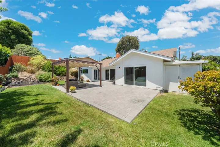 Looking northwest across yard. Notice to the right, there is an additional large storage space to the house on the right. It was attached to the home when seller's purchased.