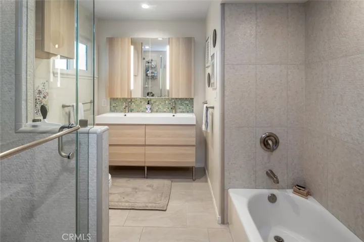 The Secondary Bath, also beautifully remodeled has dual sink vanity as well as separate tub and shower.