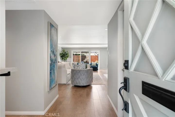 Welcome to this beautiful and light home! There are NO interior steps.  Door to the garage (and laundry) is on the  your right.