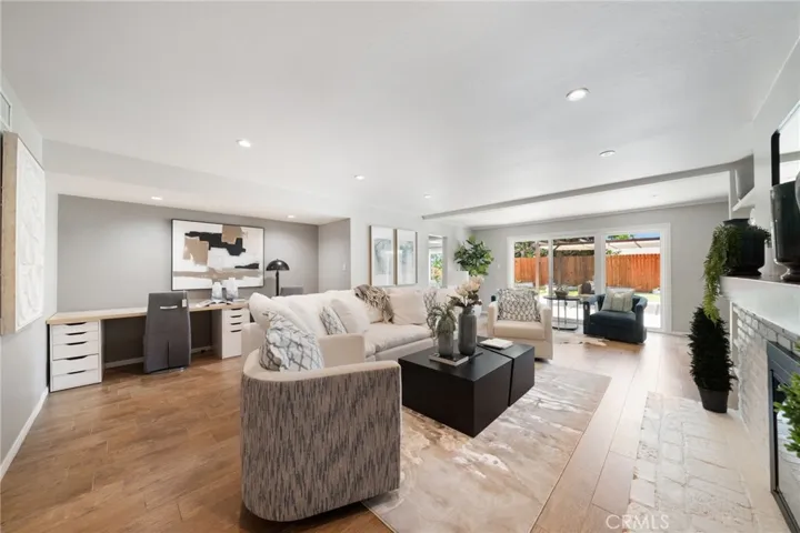 Large desk area is a converted hallway that previously connected the front bedrooms to the Master. They are now two separate wings. Great study area for students or home office.