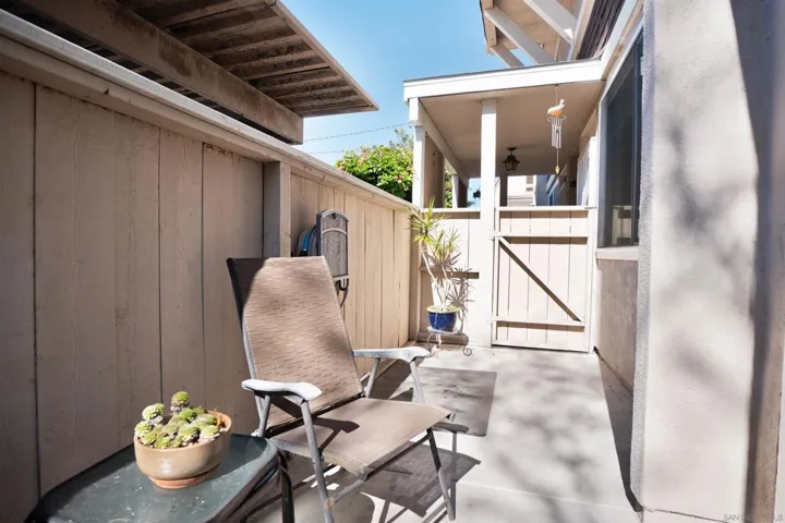 Outdoor patio in front of home accessed from dining area