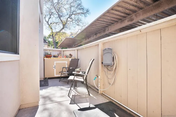 Outdoor patio in front of home accessed from dining area