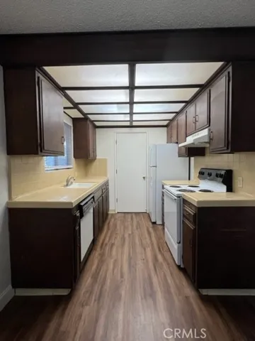 UNIT A - Kitchen -Property is currently occupied - Photos are from vacancy prior to this tenant