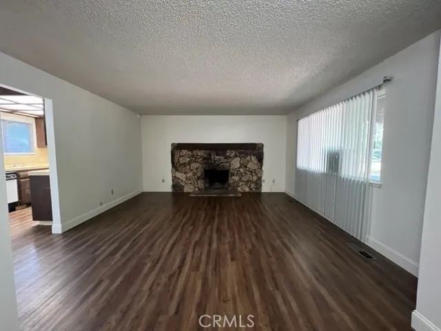 UNIT A - Family Room - Property is currently occupied - Photos are from vacancy prior to this tenant