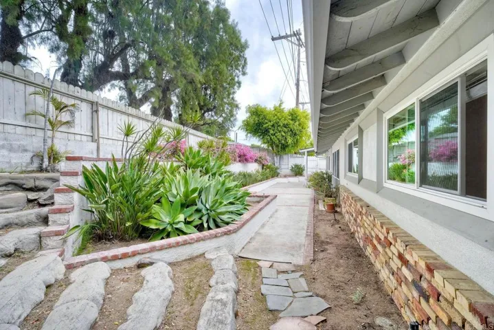 West side of house - awesome garden and patio area off the bonus room