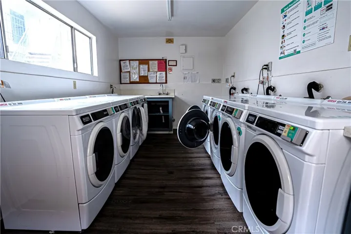 Laundry room steps away from unit