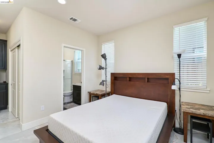 Bedroom featuring ensuite bathroom and recessed lighting
