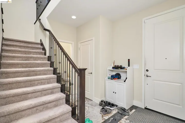 Entrance foyer featuring stairs and recessed lighting