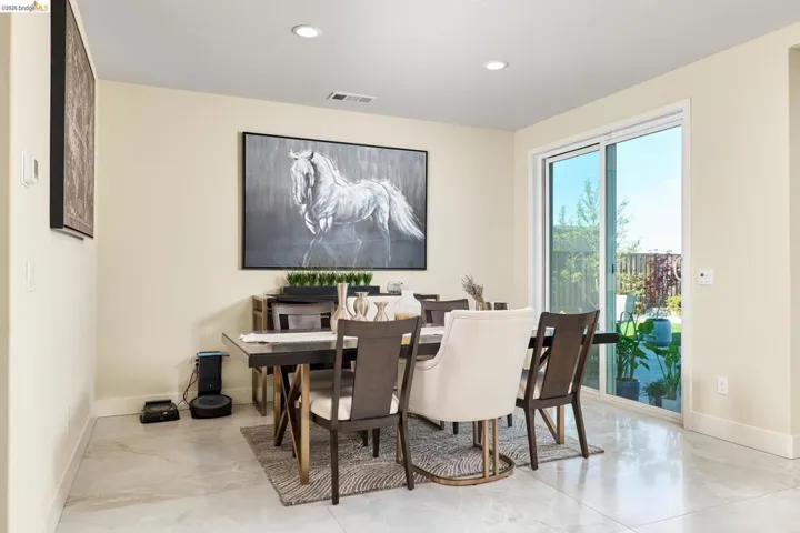 Dining space with recessed lighting and baseboards