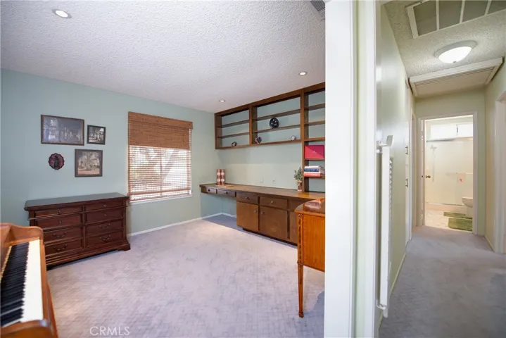 Office/den with recessed lights convertible to a 3rd bedroom.